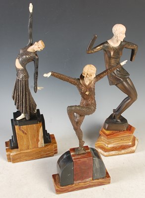 Lot 455 - Three bronzed and composite Art Deco style...