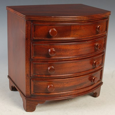 Lot 460 - A mahogany table top four drawer chest,...