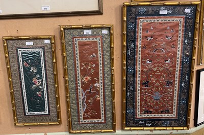 Lot 569 - Three various framed Chinese silk panels, all...
