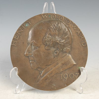 Lot 239 - A bronzed circular portrait plaque, Henry...