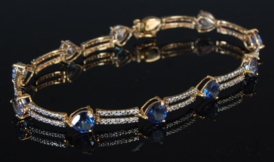 Lot 248 - A 9ct gold azure, topaz and diamond set...