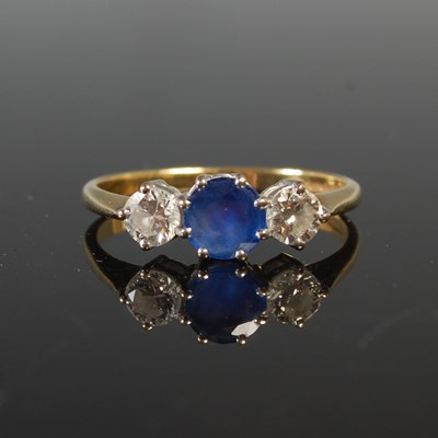 Lot 262 - An 18ct gold, sapphire and diamond three stone...