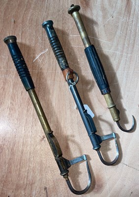 Lot 467 - Three assorted vintage fishing gaffs.