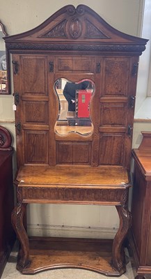 Lot 601 - A late 19th/ early 20th century oak mirror...