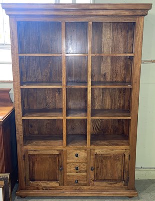 Lot 606 - A modern stained wood bookcase, fitted with...