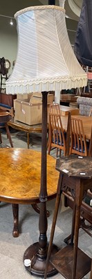 Lot 615 - A stained beech standard lamp and shade, 192cm...