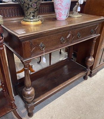 Lot 617 - An early 20th century stained wood console...