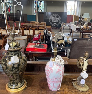 Lot 618 - A brass table lamp in the form of a fish on...