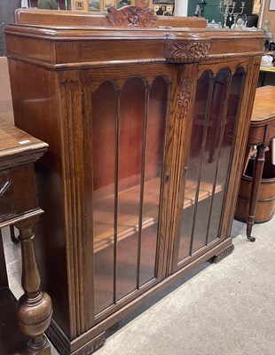 Lot 619 - An early 20th century oak Art Deco style two...