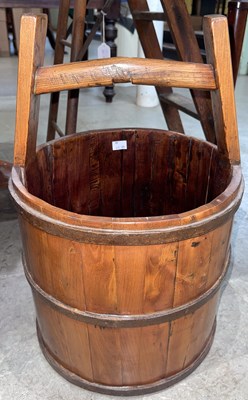 Lot 621 - A wooden bucket/ pail, with integral handle,...