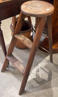Lot 622 - An early 20th century oak folding stool/ step...