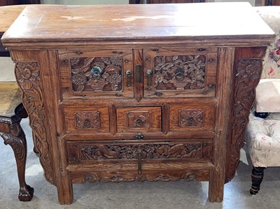 Lot 629 - A Chinese carved wood side cabinet, the...