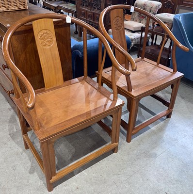 Lot 633 - A pair of Chinese horseshoe back armchairs,...