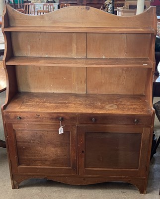 Lot 667 - A small pine dresser, the upright back with...