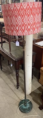 Lot 670 - An early 20th century brass standard lamp and...
