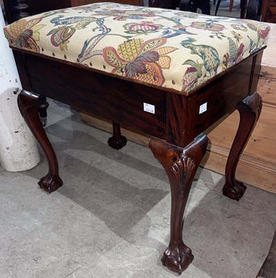 Lot 671 - A rosewood piano stool, the hinged rectangular...