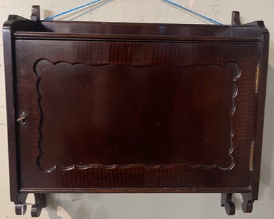 Lot 691A - A vintage mahogany hanging cabinet, with...