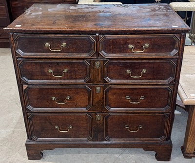 Lot 697 - An antique oak chest of drawers, the...
