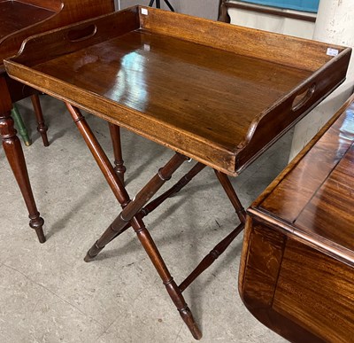 Lot 704 - A 19th century mahogany butlers tray on stand,...
