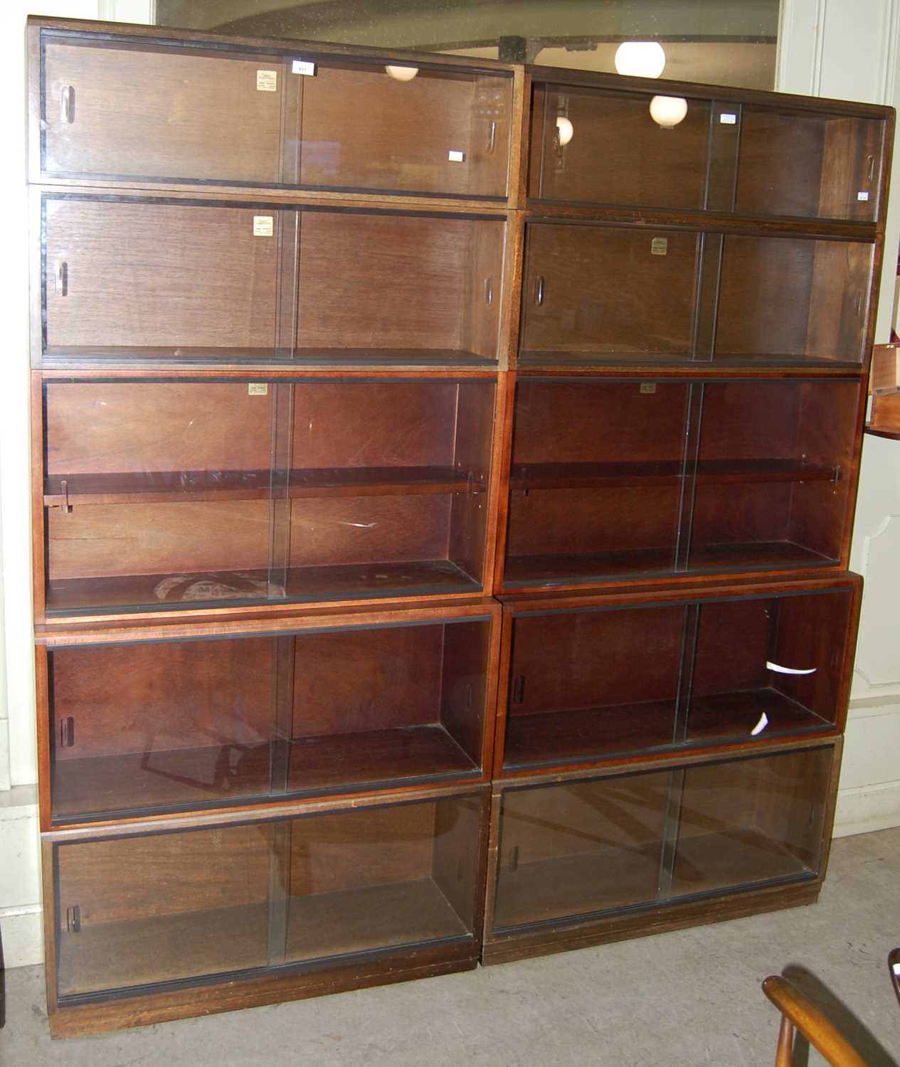 Lot 617 - A pair of Simplex sectional bookcases,