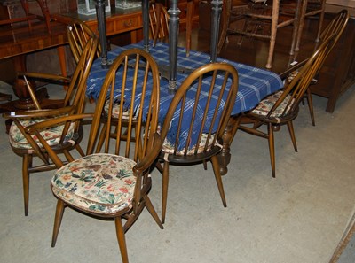 Lot 618 - A vintage Ercol dining room suite comprising...