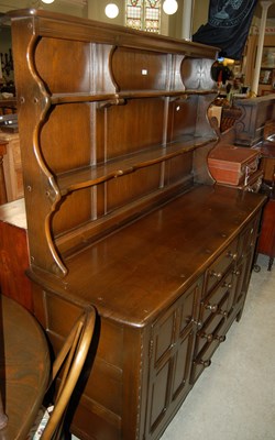 Lot 618 - A vintage Ercol dining room suite comprising...