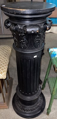 Lot 726 - A carved and black painted wooden pedestal in...