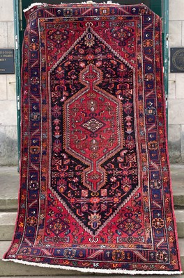 Lot 748 - A Persian rug, the rectangular ground centred...