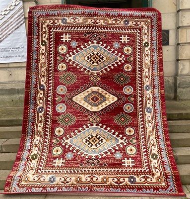 Lot 730 - A machine made red Qashqai carpet, 335cm x 241cm.