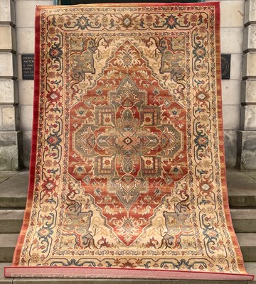 Lot 729 - A machine made Ziegler carpet, colour red,...