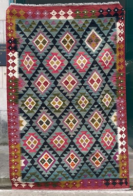 Lot 738 - A Maimana Kilim rug, the black and green...