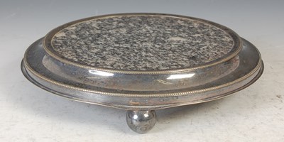 Lot 159 - A circular grey granite teapot stand, by...