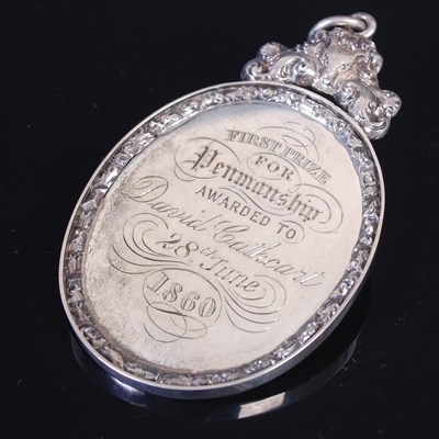 Lot 30 - A silver prize medal of oval form with cast...