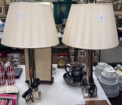 Lot 649 - A pair of chrome table lamps and shades, 79cm...
