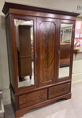 Lot 828 - An Edwardian inlaid mahogany triple wardrobe...
