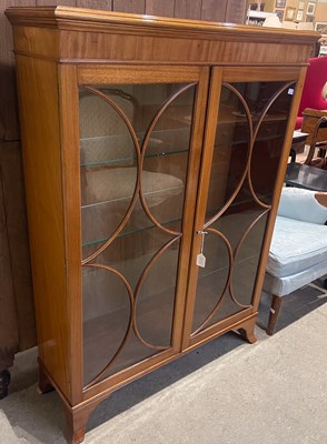Lot 829 - A vintage glass front cabinet, the interior...