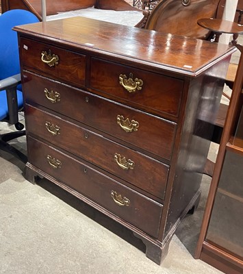 Lot 831 - A Georgian mahogany two over three chest of...