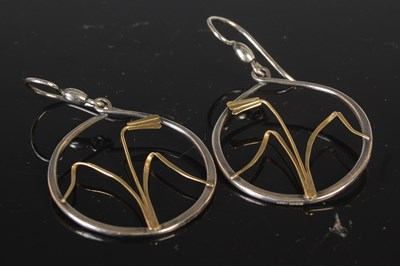 Lot 355 - A pair of silver and gold drop earrings of...