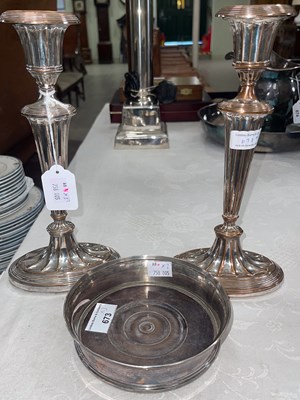 Lot 673 - A silver plated bottle stand, 14.5cm wide;...