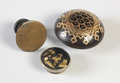 Lot 444 - Two Japanese shakudo dress studs with gold...