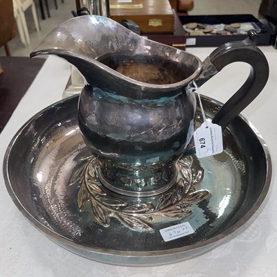 Lot 674 - An Arts & Crafts silver plated large hammered...