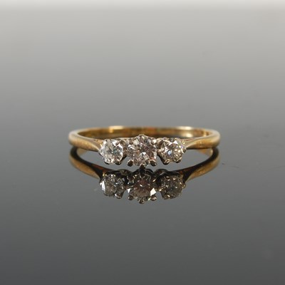 Lot 322 - A diamond three stone ring, with raised...