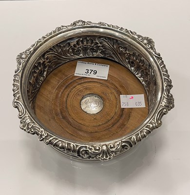 Lot 379 - A George III silver wine coaster, by John &...
