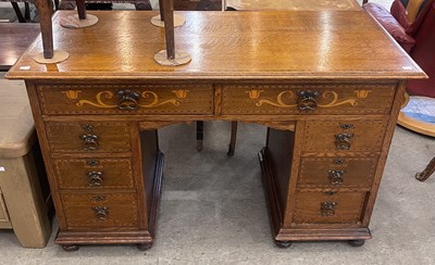 Lot 880 - An Art Nouveau oak and marquetry inlaid...
