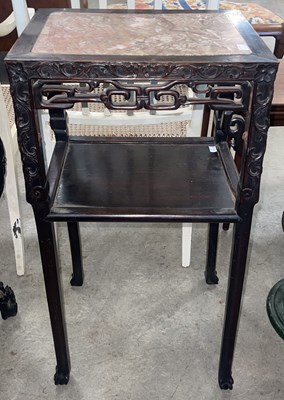 Lot 854 - A Chinese darkwood urn stand, Qing Dynasty,...