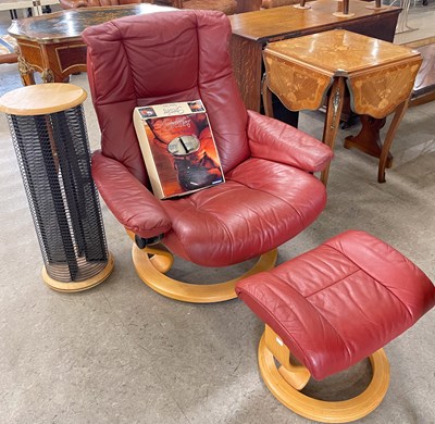 Lot 884 - A Stressless recliner chair in red leather...