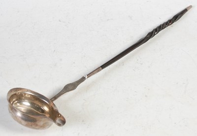 Lot 219 - An antique white metal toddy ladle with baleen...