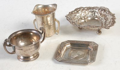 Lot 222 - A group of four pieces of silver to include an...