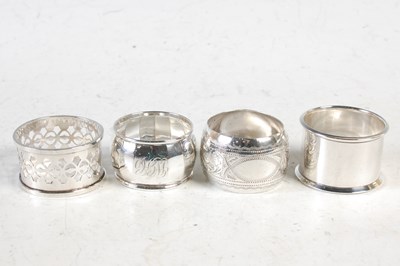 Lot 232 - Four assorted silver napkin rings, 2.5 troy ozs.