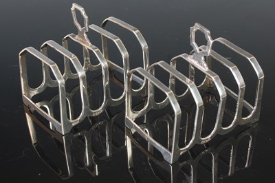 Lot 236 - A pair of Birmingham silver five bar toast...